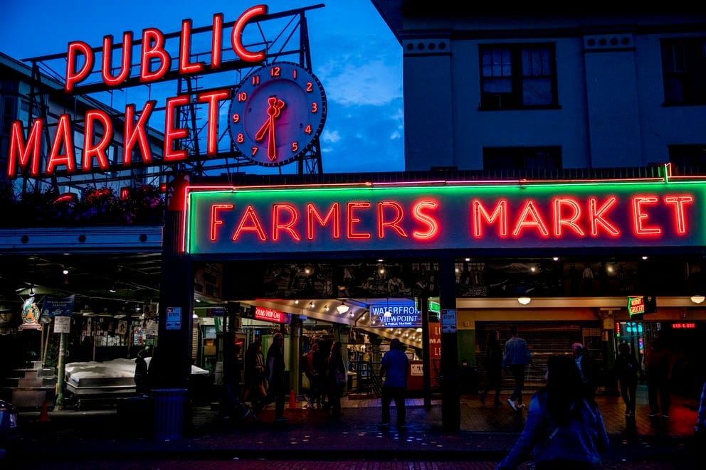 Pike Place Market sign aglow at night