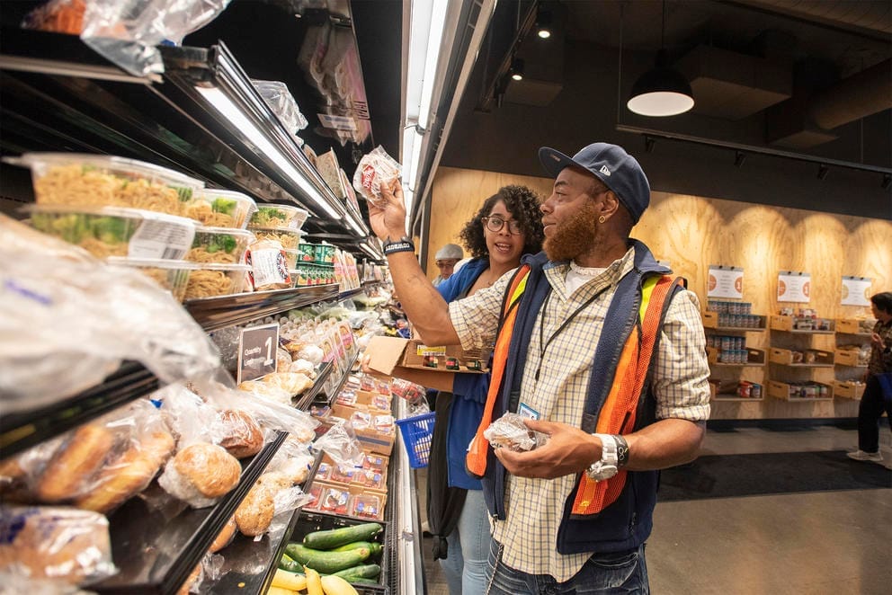 Two people inside a food bank