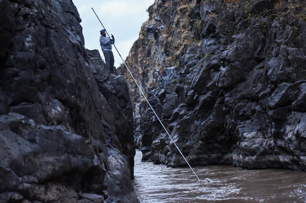 Yakama Nation fisherman William Spoonhunter dip-net fishes