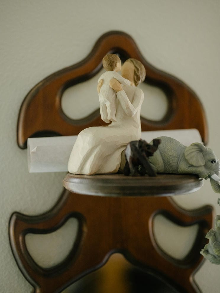 Wooden carving of mother and child