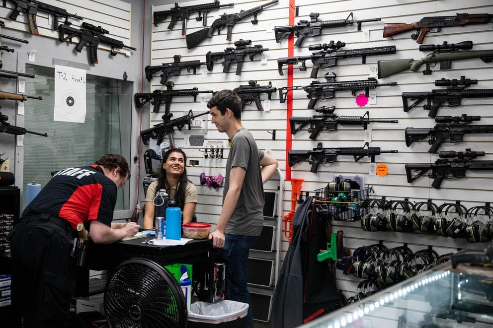 Employees at gun range go over paperwork