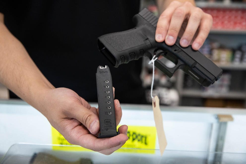 Person holding gun in hand