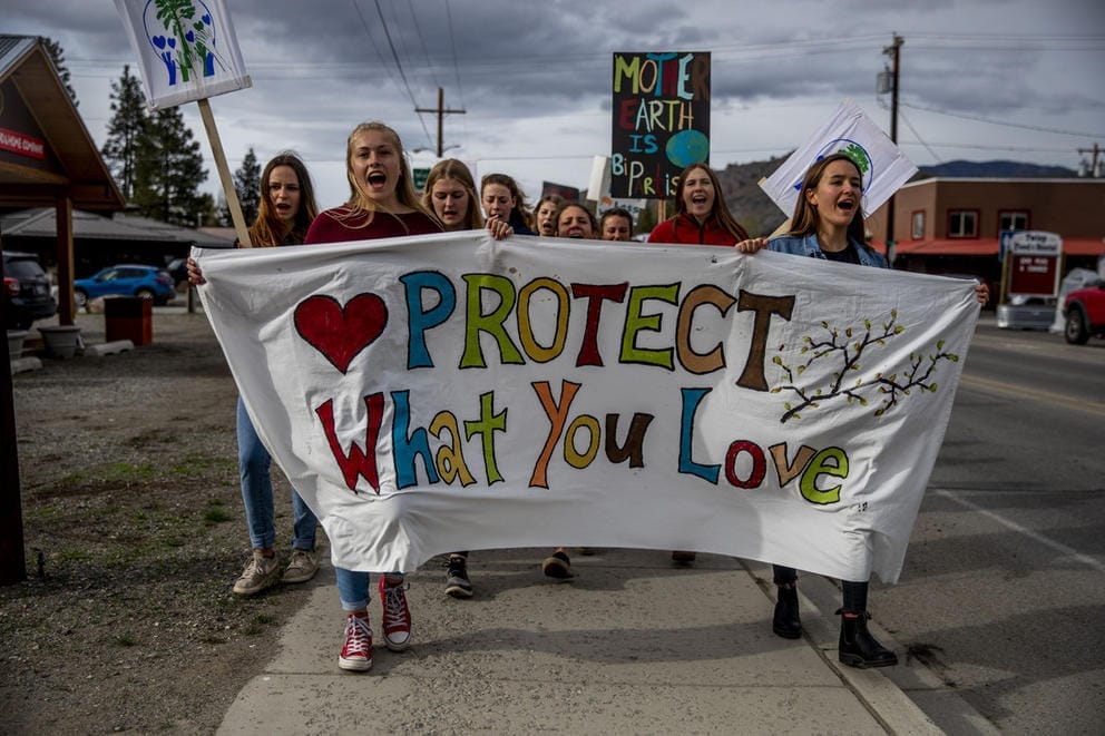 Students holding a banner that reads 