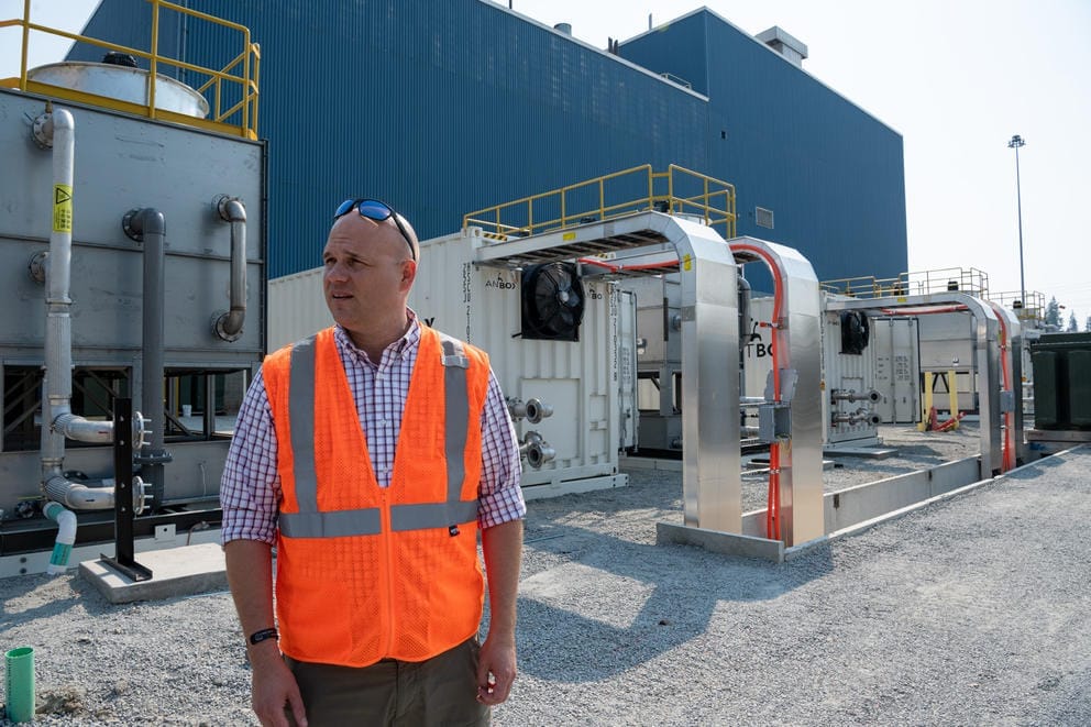 Monty Stahl stands by the Ant Boxes at the Merkle Standard cryptocurrency mining facility