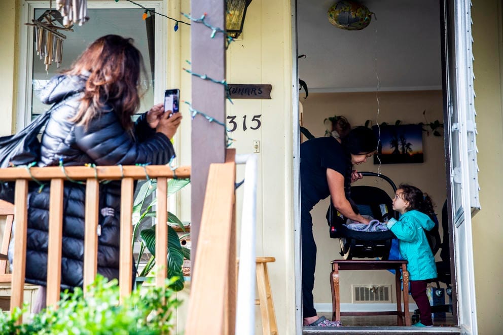 Jayshree takes photos from the porch
