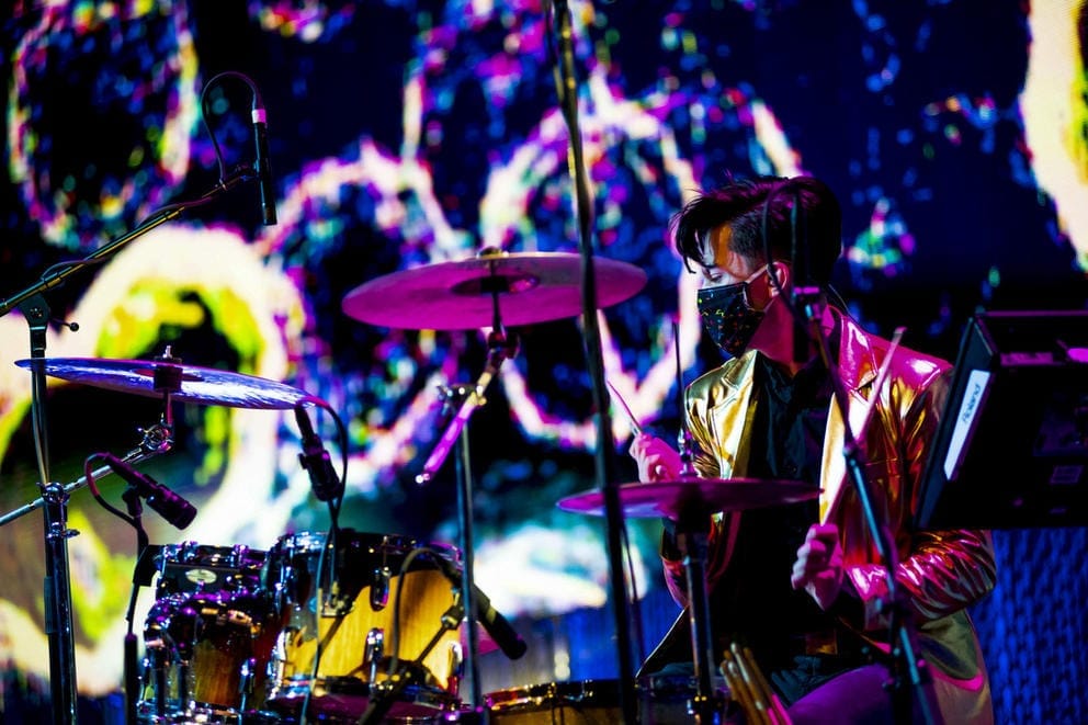 Person behind drum set