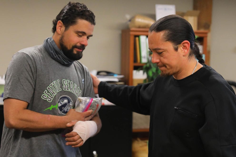 Heal for Reentry program manager Leandru Willie, right, says goodbye to Doni Sumner at the HEAL