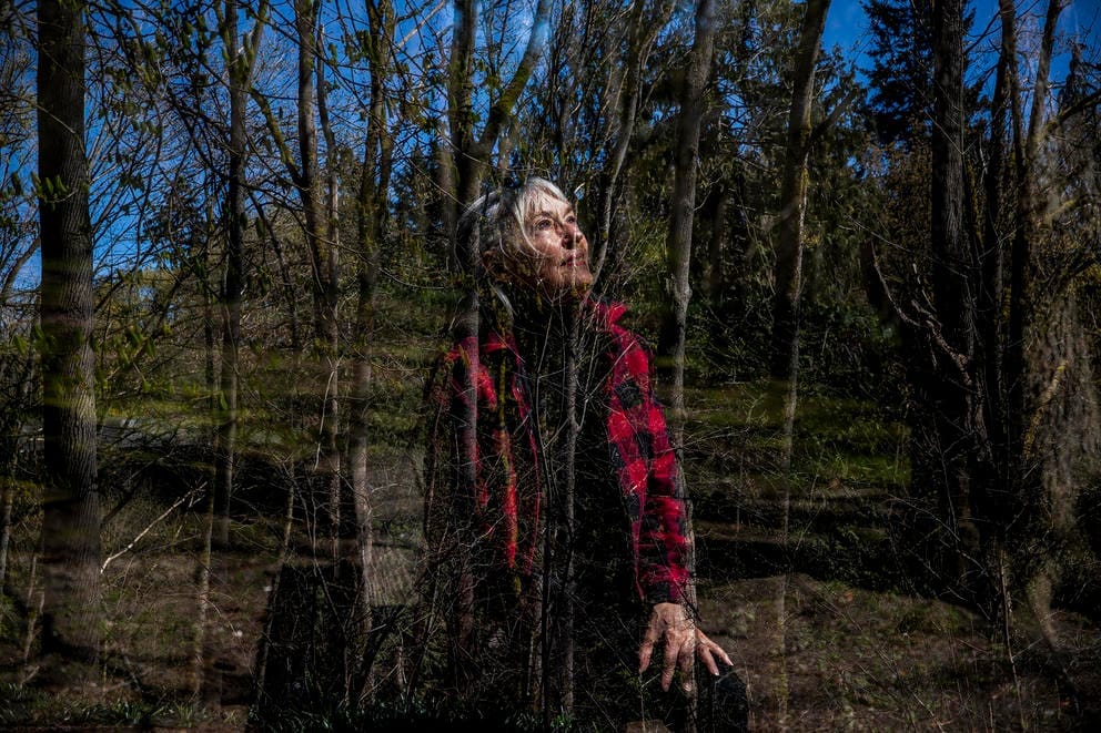 Judy Lightfoot blends into a wooded background in this double exposed image