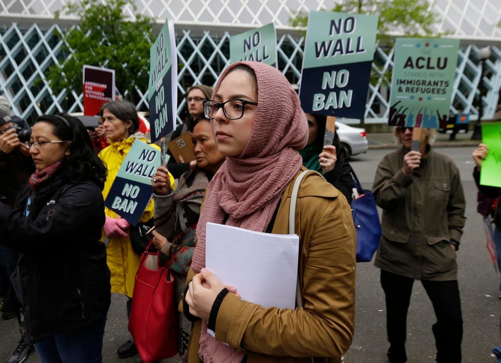 Isra Ayesh waits for her turn to speak during a demonstration.