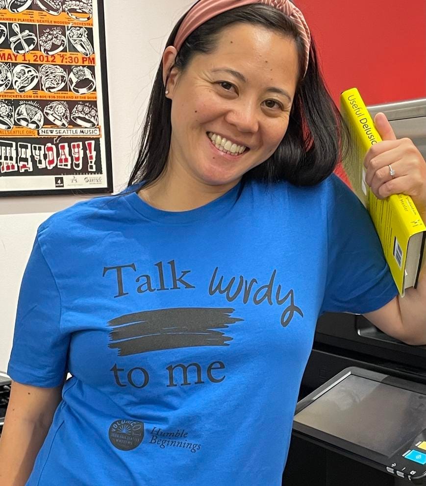 a woman in a blue t-shirt that reads