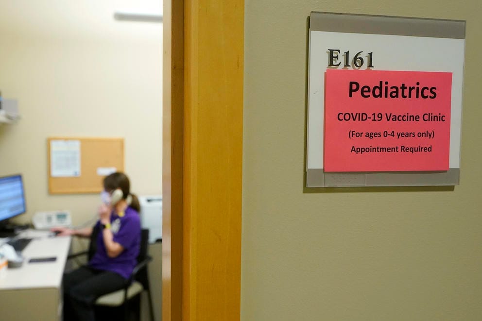 Sign outside a medical exam room reads