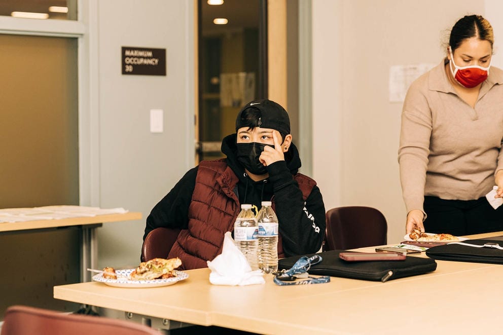 Vy Vu watches a presentation