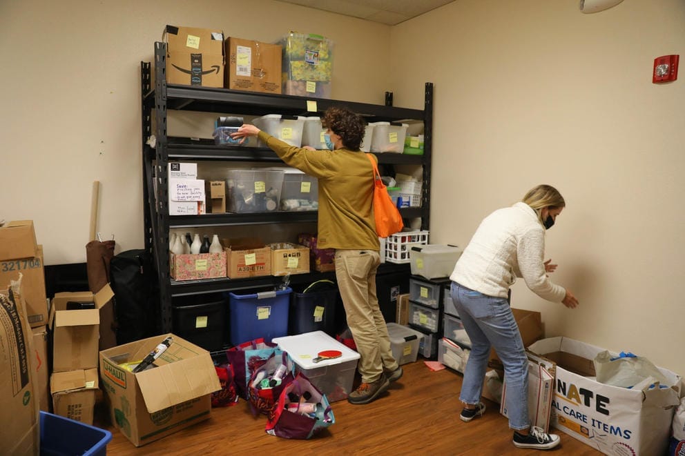 Workers sorting supplies