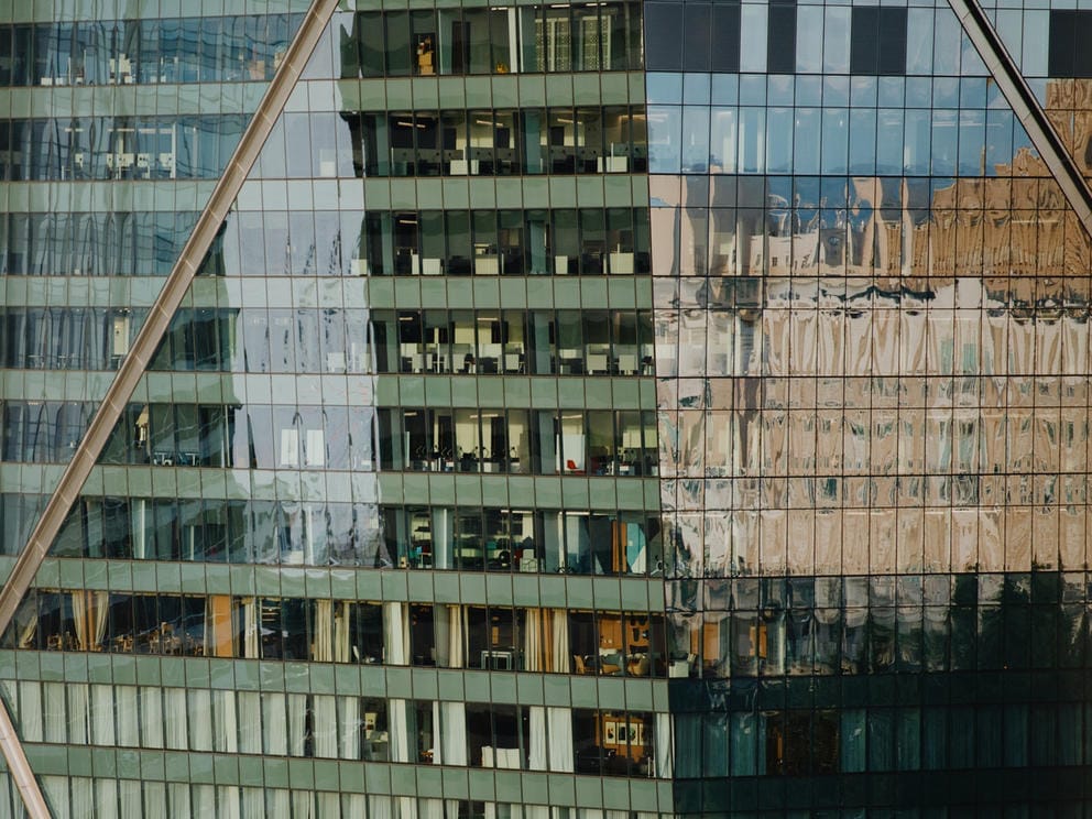 A close up of the side of a glass office building