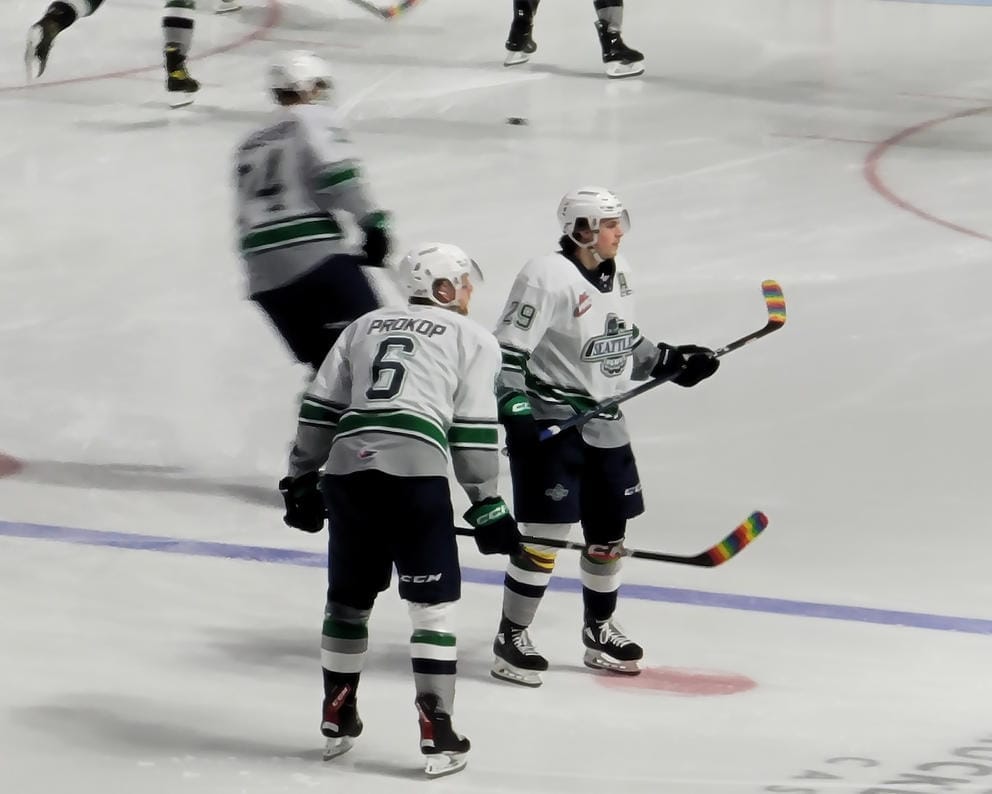 Luke Prokop and several players on the ice during warmup at the March 21 Thunderbirds game