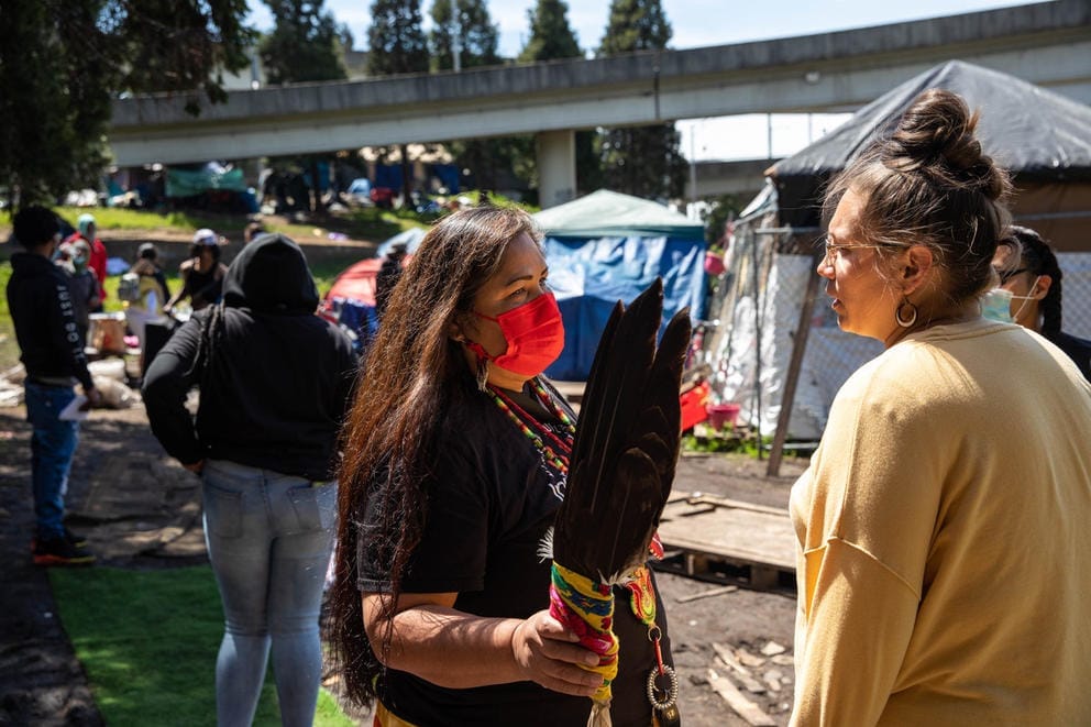 Roxanne White gives Tashina Bulltail an update on her missing sister