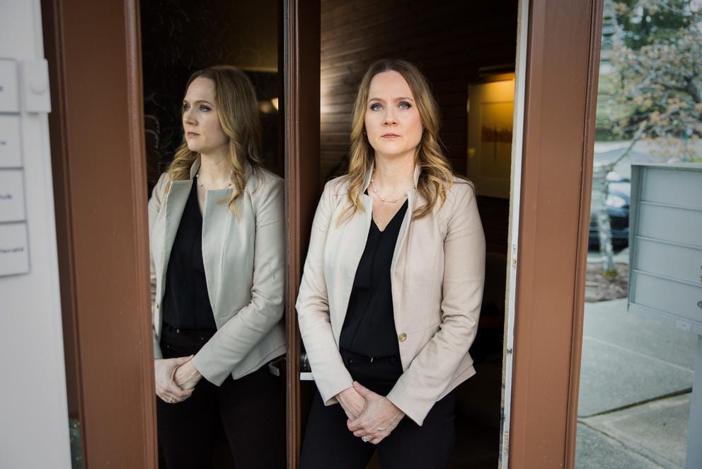 Sara Weelborg stands at the entrance of her office building