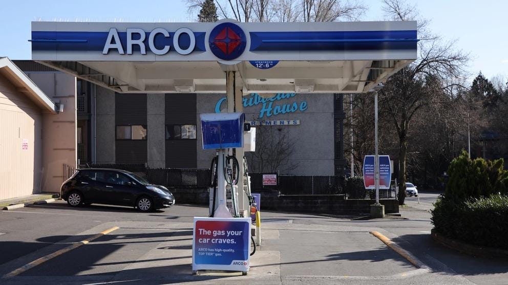 An Arco gas station pictured next to an apartment building in Seattle