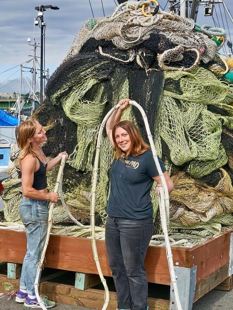 Camrym Patrick and a crewmate clown amidst a pile of netting.