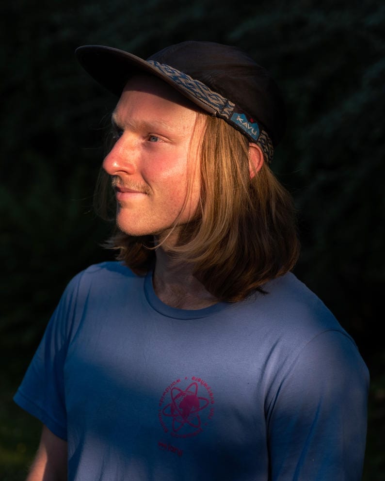 A close up portrait of Roberts in a patch of sunlight