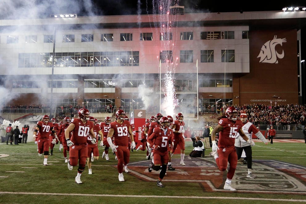 Football players at the WSU stadium