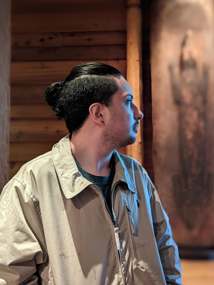 Andres “Dre” Thornock visiting the Hibulb Cultural Center, where they found a photo of their ancestor.