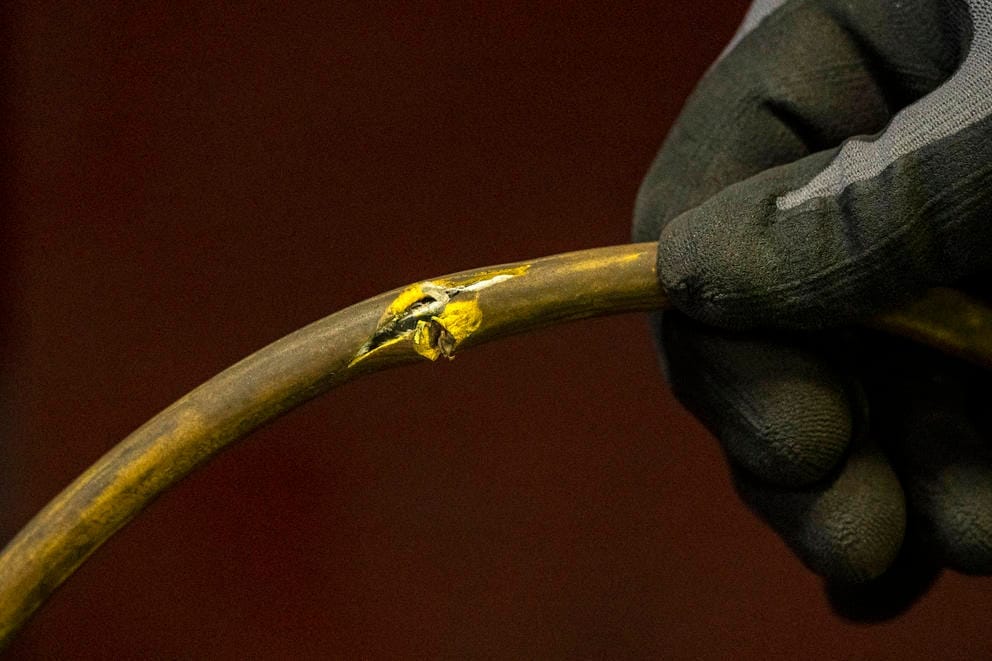 A close up of a frayed electrical cord.
