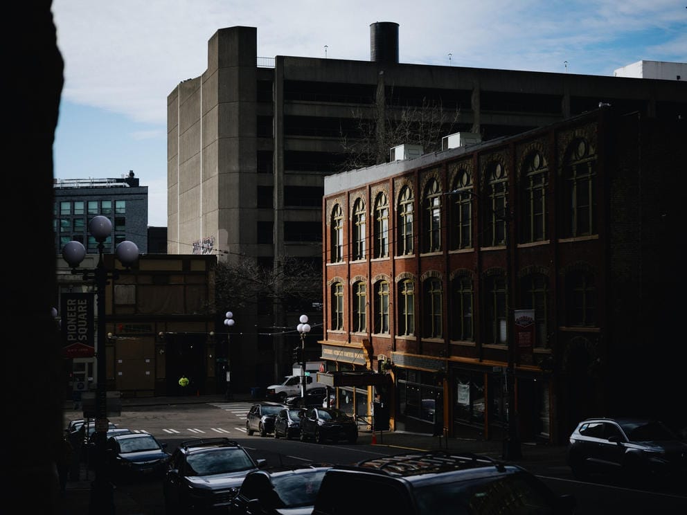 Buildings downtown are lit up by the evening sun