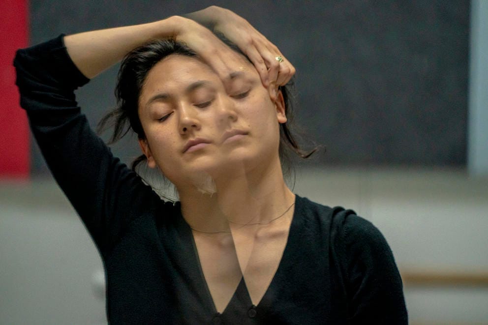 dancer Leah Terada is reflected in a studio mirror while rehearsing