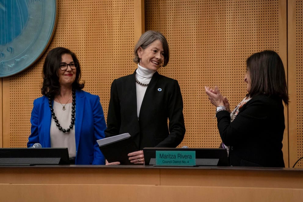 Councilmember Sara Nelson, center, receives recognition being chosen as council president