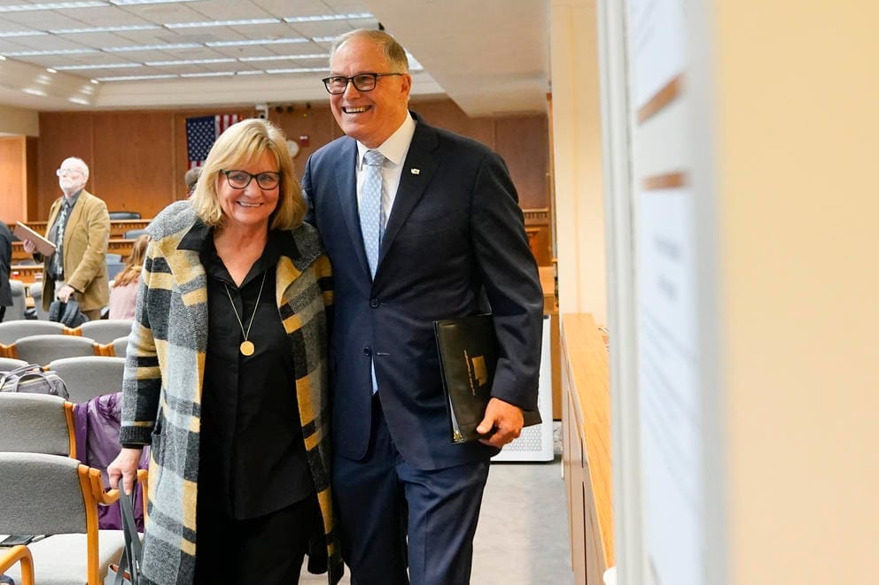 Washington Gov. Jay Inslee leaves with wife Trudi Inslee