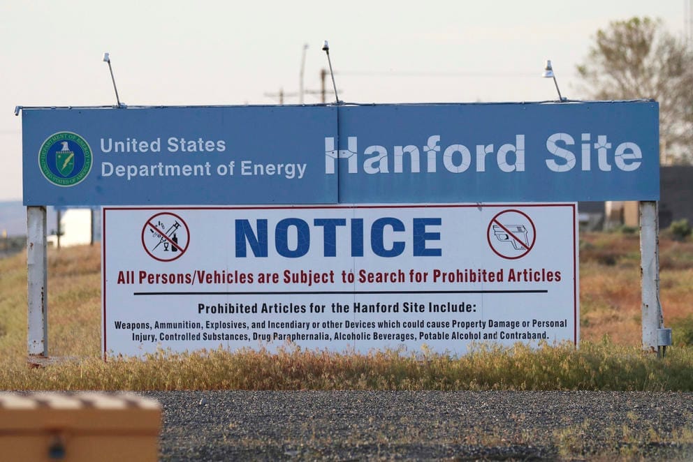 signs are posted at an entrance to the Hanford Nuclear Reservation in Richland, Wash.