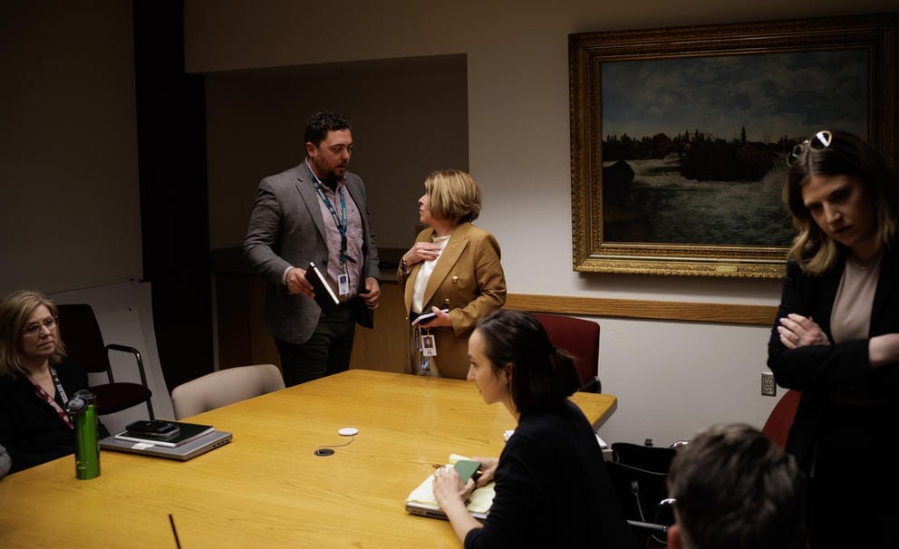 Spokane Mayor Lisa Brown talks to chief of staff Alex Scott 