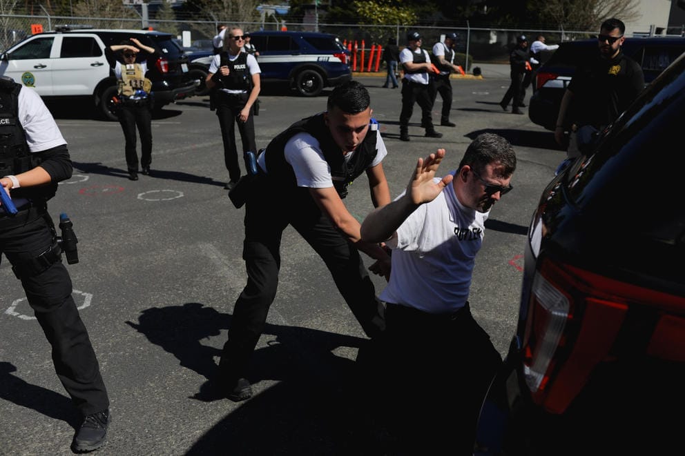 New police recruits practice traffic stop arrests at Washington's Criminal Justice Training Center.