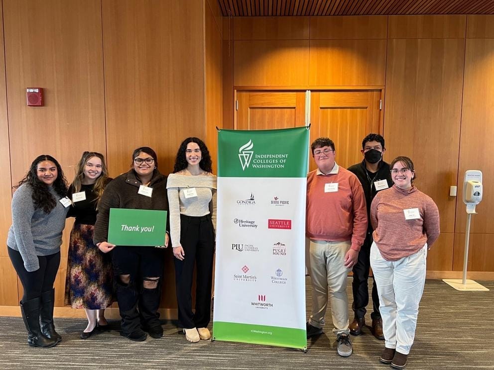 Athaliah P.S. Ioane attends the Independent Colleges of Washington Board Breakfast alongside other students.