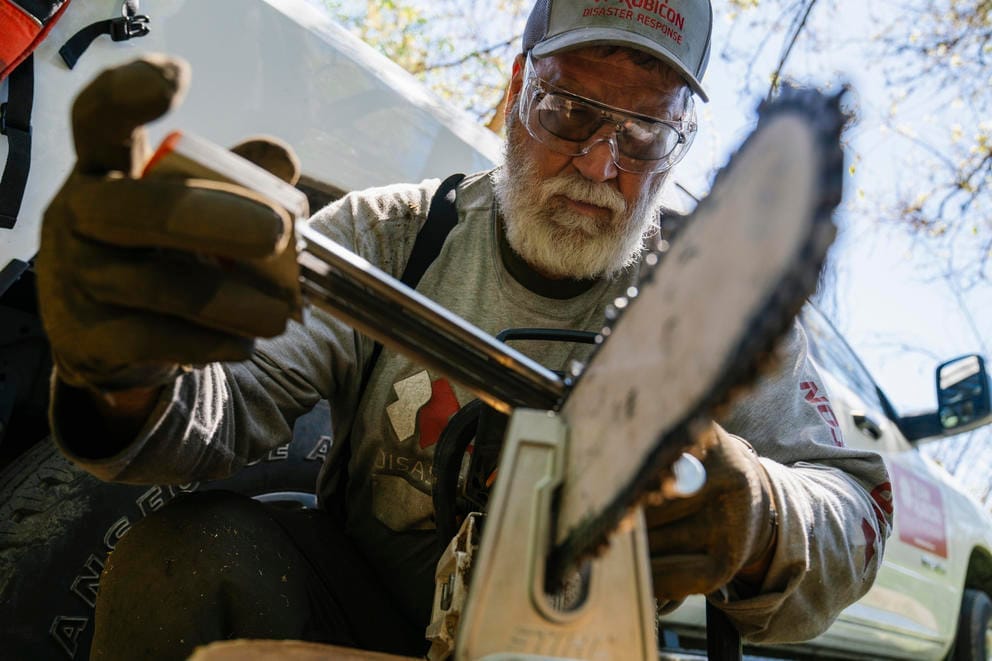 Jeff Sesak sharpens a chainsaw