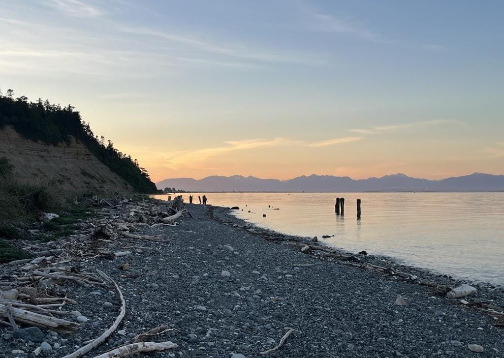 A rocky beach at sunset