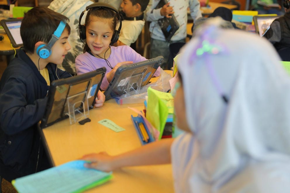 Samya Heyadee, 7, works on reading skills with her 2nd grade classmates at Parkside Elementary, May 1, 2023.
