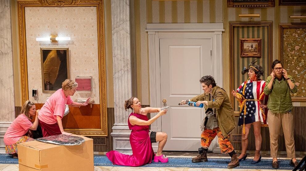a scene from a play in which six women are fighting in various states of dress