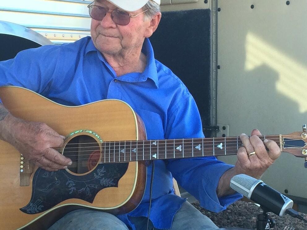 Playing country music on his guitar was another of the author's father's lifelong passions.