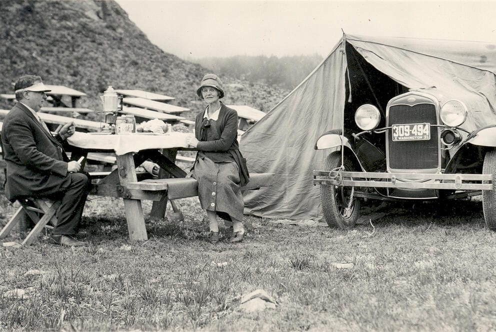A couple with a tented car.