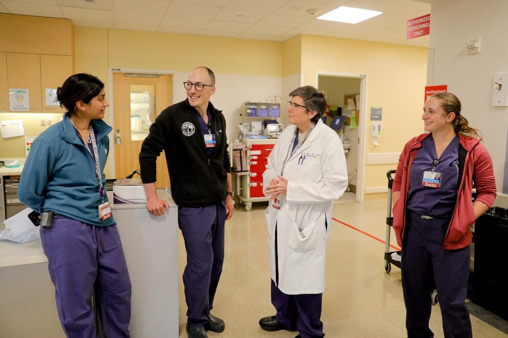 Chief of Surgery Dr. Eileen Bulger talks with her surgical fellows