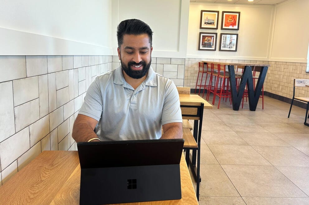 Tanveer Sangha works at a laptop