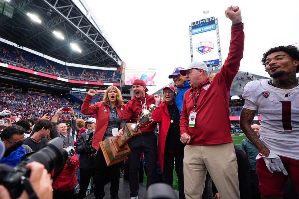 WSU President Kirk Schulz (from right) celebrates a 2024 Apple Cup win in Seattle with Gov. Jay Inslee, Trudi Inslee, head coach Jake Dickert, and athletic director Anne McCoy.