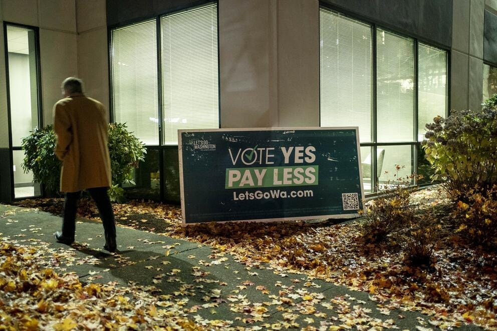 A sign in front of a building says