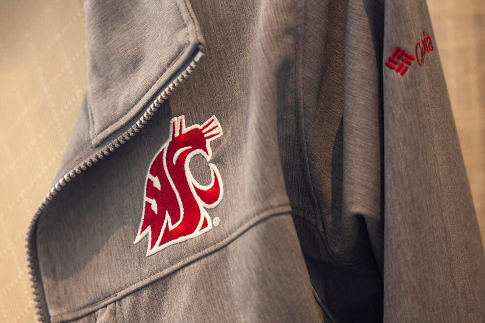 A WSU jacket hangs on a chair