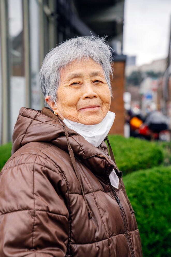 Juan Lu, 80, is a resident of Seattle's Chinatown/International District (CID) and said she voted for Trump in the 2024 presidential election, seen here waiting in line at the Seattle Indian Center's food bank in November. She said that she was worried about safety in the neighborhood and knew many others who voted for Trump. (M. Scott Brauer / Cascade PBS) (M. Scott Brauer)
