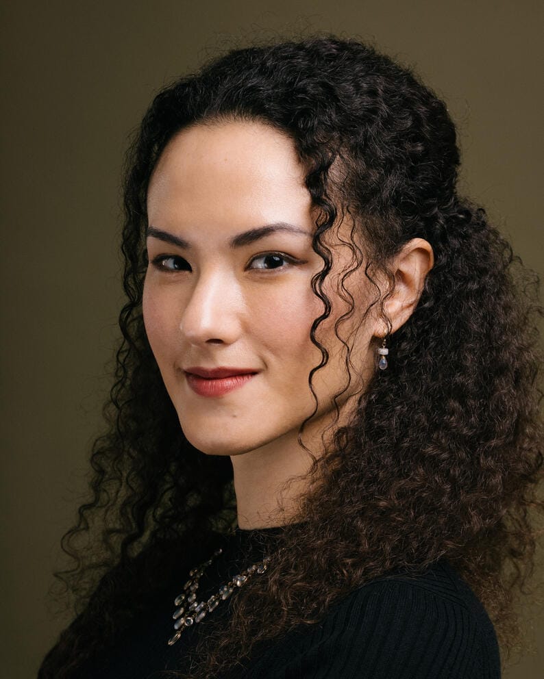 a photo of a woman with curly hair