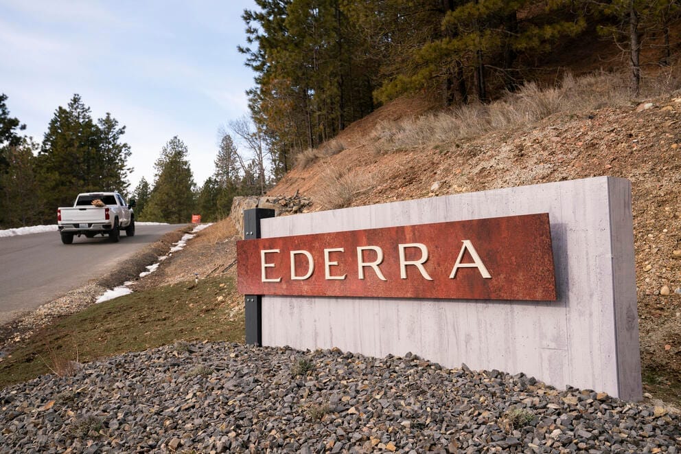 Truck passes Ederra development sign