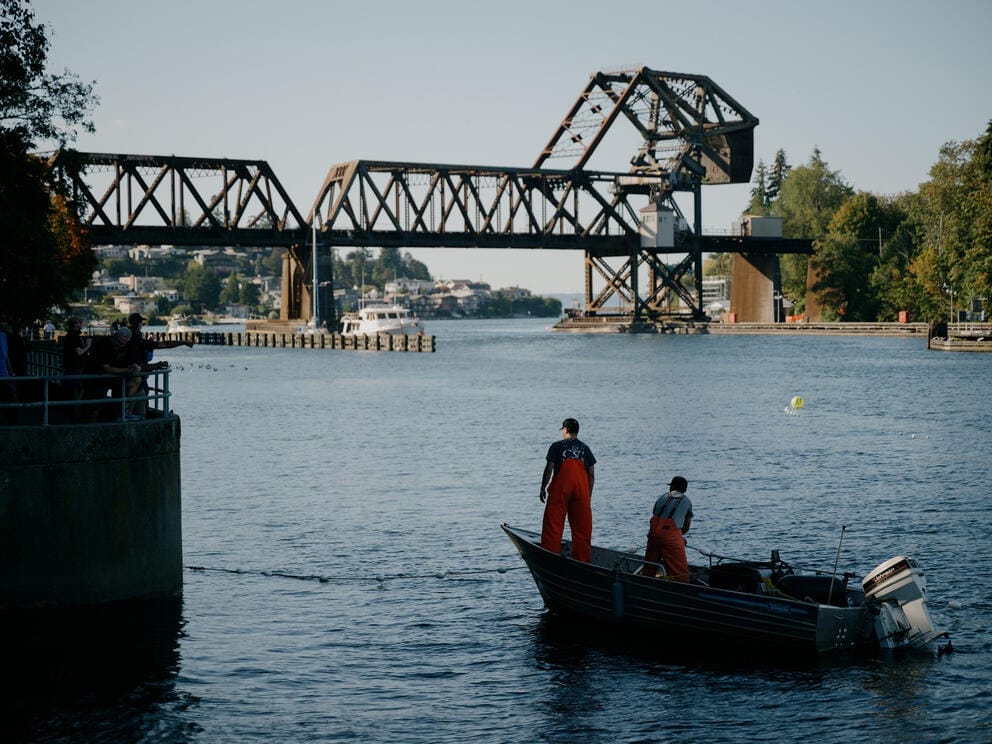 Two fisherman on a small fishing boat on the Puget Sound